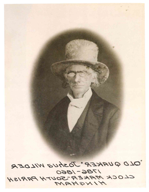 一个戴着眼镜和大礼帽的老人的画像.