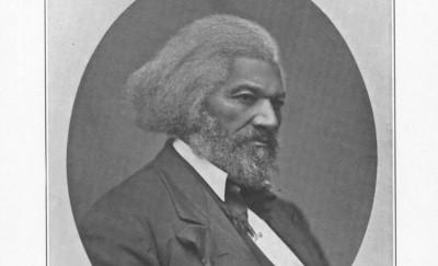 A black and white portrait of a African American man wearing a suit.